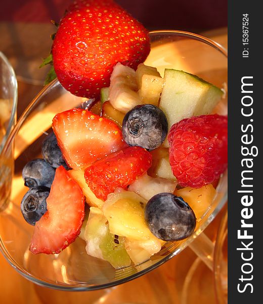 Multicolored fresh summer fruit-dessert closeup. Multicolored fresh summer fruit-dessert closeup