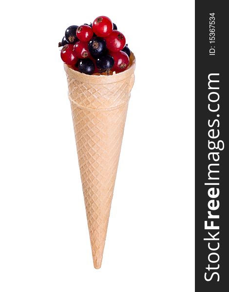 Black and red currant fruit in ice cream cone. Black and red currant fruit in ice cream cone