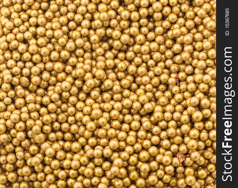 Close up of little golden balls