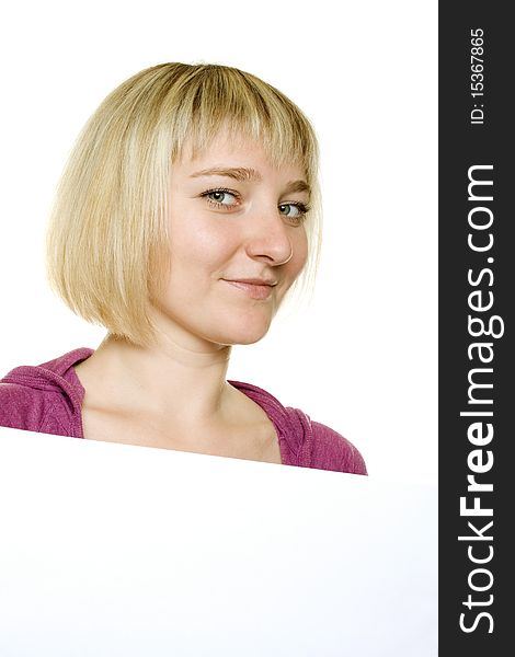 Close-up of a young woman leaning on billboard on white background