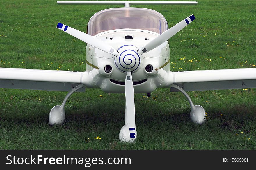 A small airplane with one propeller in the front