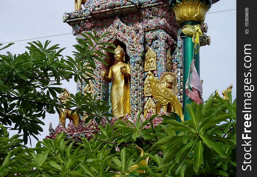 Beautiful buddha image in the temple.Buddha image made from cement in golden color.