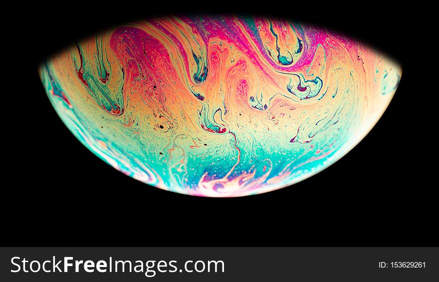 Virtual reality space with abstract multicolor psychedelic planet. Closeup Soap bubble  like an alien planet on black background. Virtual reality space with abstract multicolor psychedelic planet. Closeup Soap bubble  like an alien planet on black background