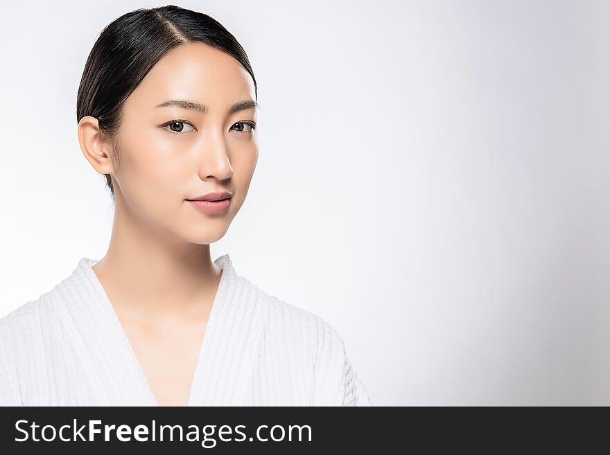 Beautiful Young Asian Woman with Clean Fresh Skin