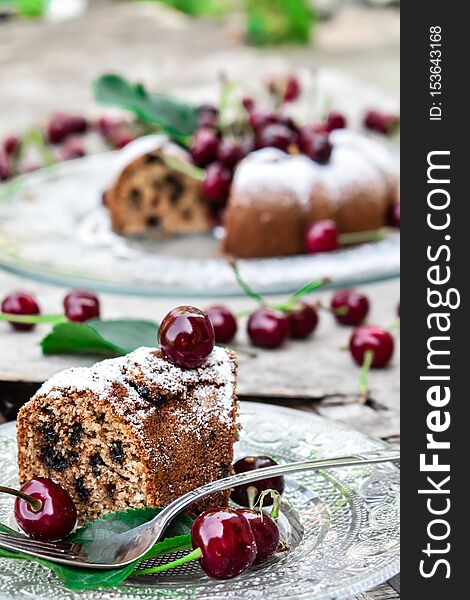 Served slice of rustic homemade kouglof with chocolate and cherries. Served slice of rustic homemade kouglof with chocolate and cherries.