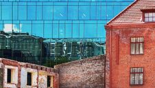 Windows Reflection Modern New Building And Old Vintage House Blue  Glass And Stone Of Front House Wall  Red Heart Stock Images
