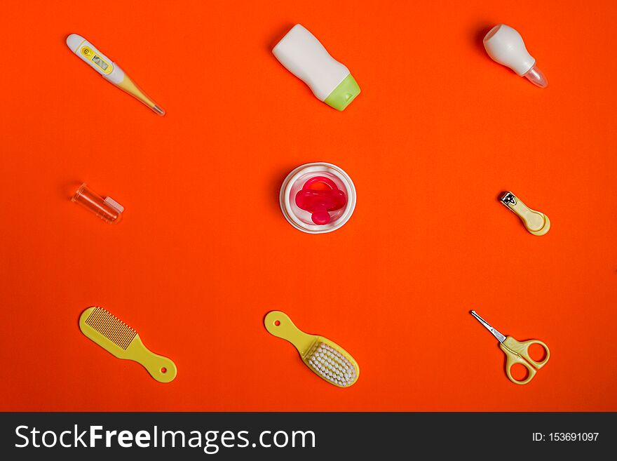 Baby`s Accessories On Red Background, Top View