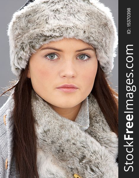 Young Woman Wearing Fur Hat And Wrap