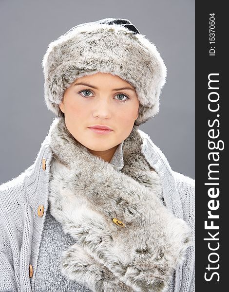 Young Woman Wearing Fur Hat And Wrap