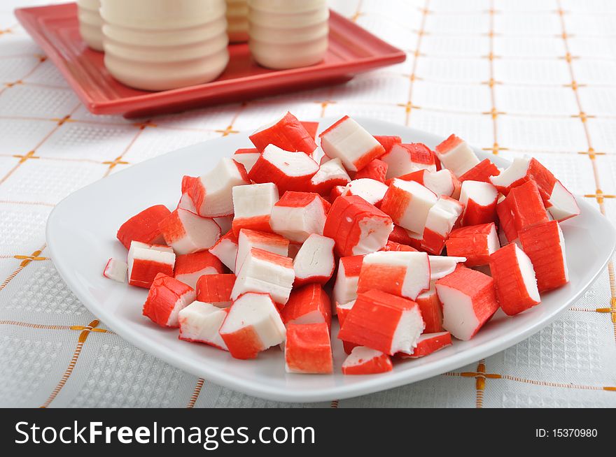 Pile of surami cube on white plate. Pile of surami cube on white plate