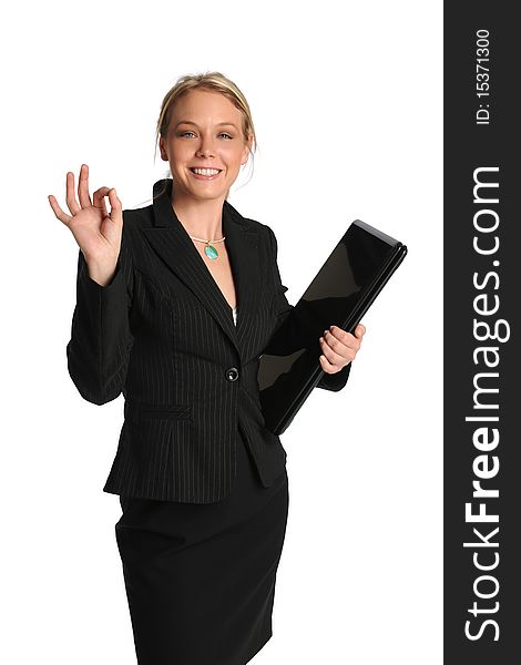 Young businesswoman holding a laptop and with OK sign isolated on a white background