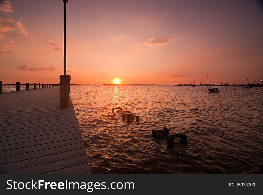 Sunset over dock and water