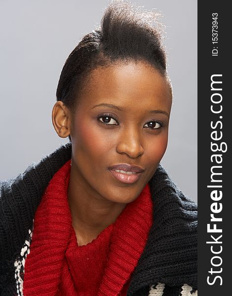 Fashionable Young Woman Wearing Knitwear In Studio Smiling