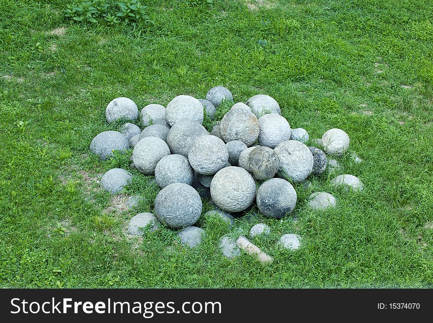 Antique Cannonballs on a grass