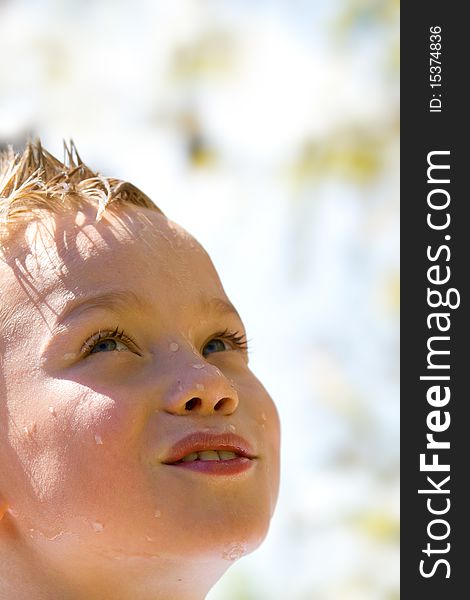 Young child with water drop on face. Young child with water drop on face