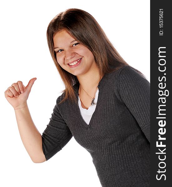 A happy young teen pointing behind with her thumb.  Isolated on white. A happy young teen pointing behind with her thumb.  Isolated on white.