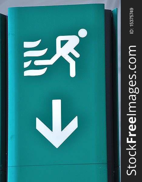 A getting away symbol and down toward arrow in airport, means leave or dangerous escape. A getting away symbol and down toward arrow in airport, means leave or dangerous escape.