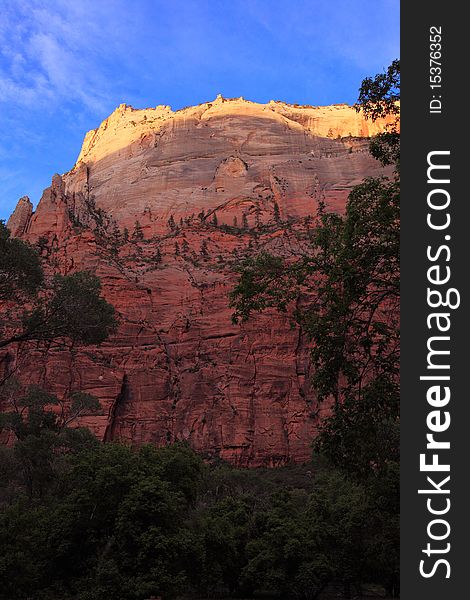 The last touch of the sun light before twilight on Zion national park mountain ridge.