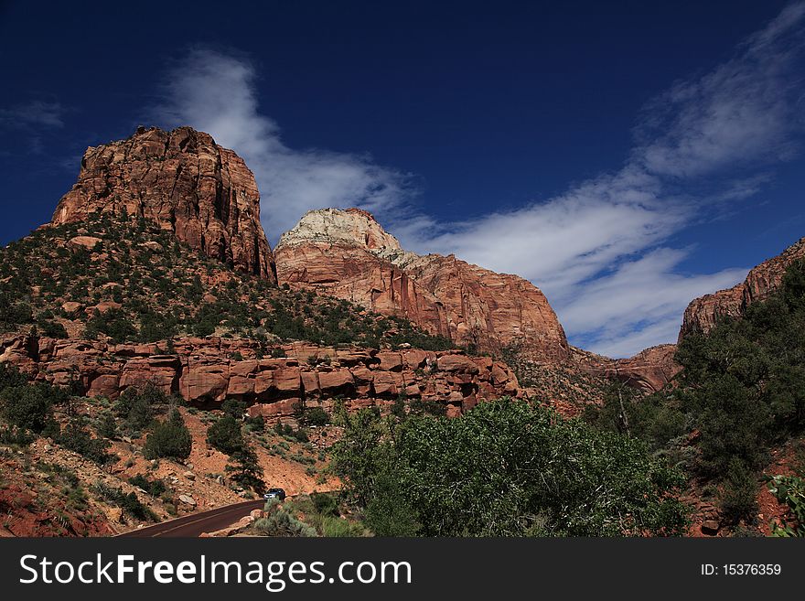 The road to approach Zion National Park. The cloud sky with magnificent landscape composes increasable landscape. The road to approach Zion National Park. The cloud sky with magnificent landscape composes increasable landscape.