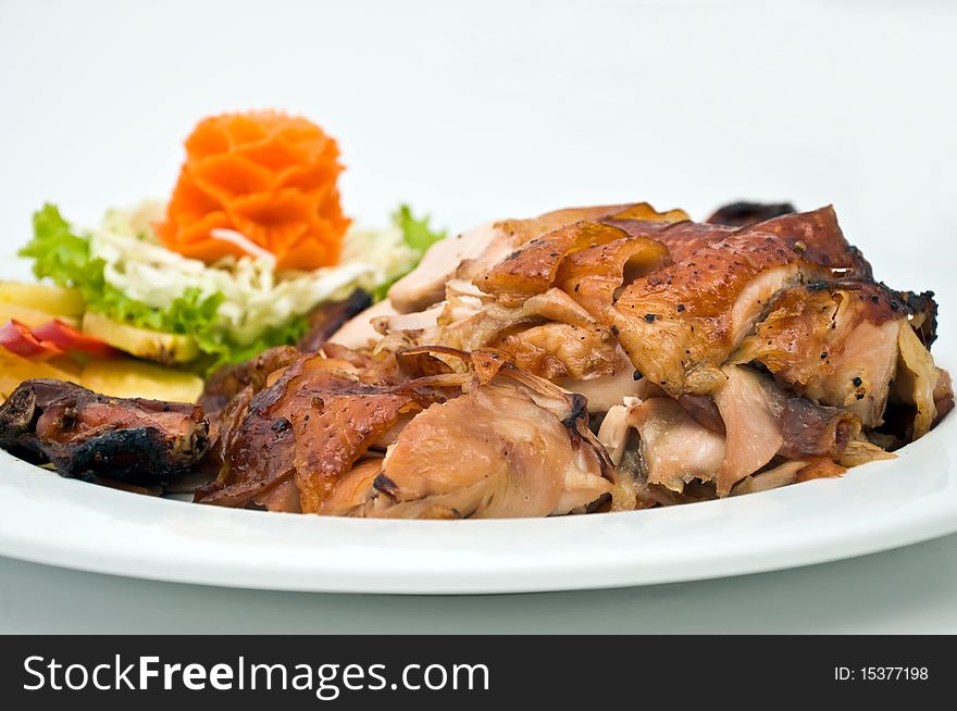 Grilled chicken in white plate, white background. Grilled chicken in white plate, white background.