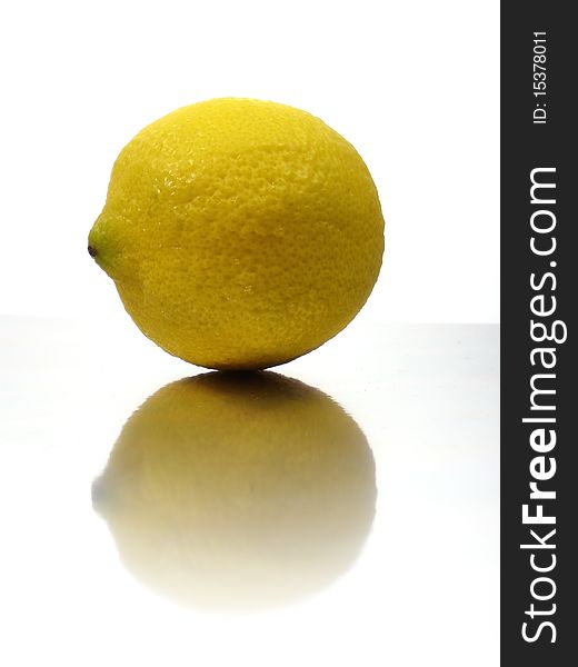 Lemon on white background with reflection effect
