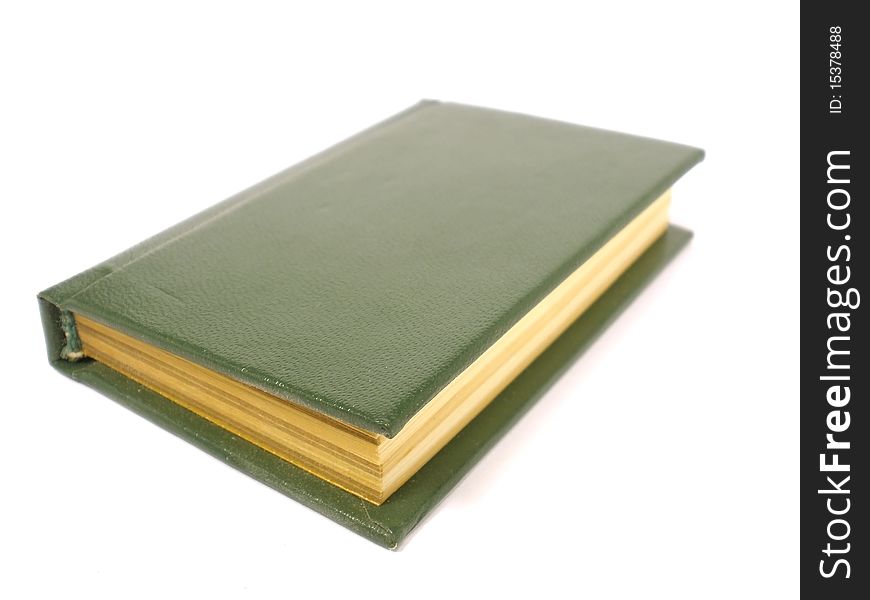 Small dark green book on the white isolate background. Small dark green book on the white isolate background