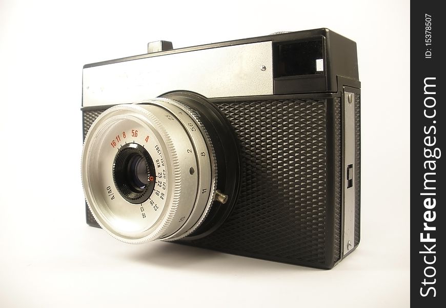 Vintage photo camera on the white isolate background