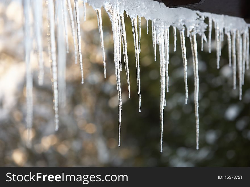 Close Up Of Some Icicles Hanging From Roof