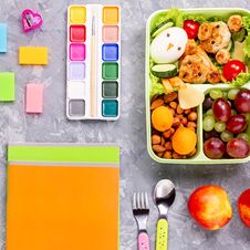 School Supplies And Lunchbox With Food For Kids. Colorful Stationery Layout On Multicolor Background, Copy Space Royalty Free Stock Photos