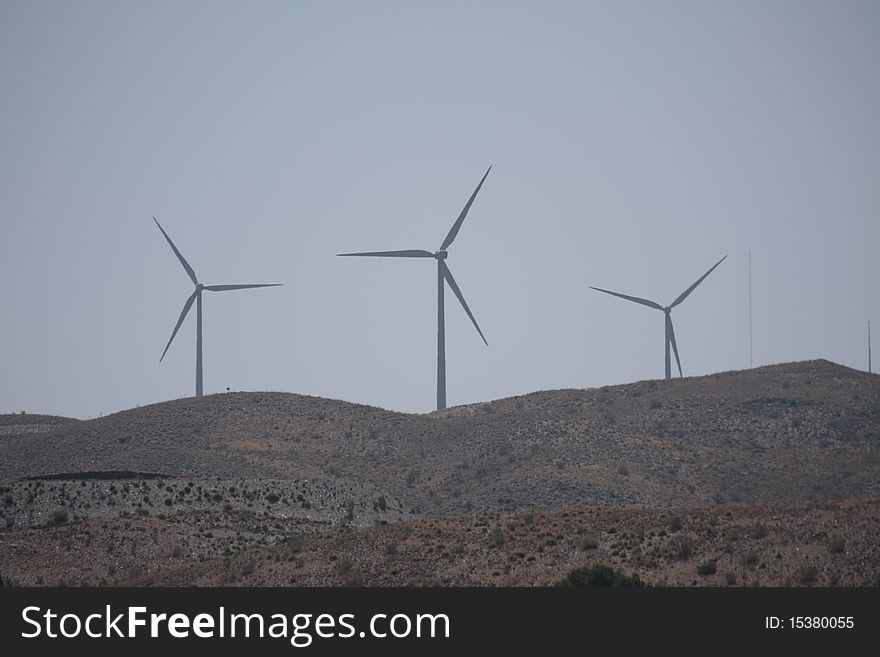 Three wind turbines on a hill in Almeria province, Spain