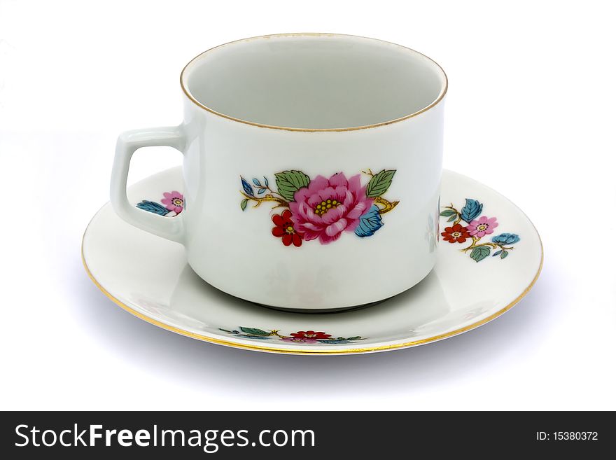 Floral tea cup and saucer on a white background. Floral tea cup and saucer on a white background