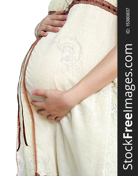 Pregnant woman caress her abdomen lovingly.