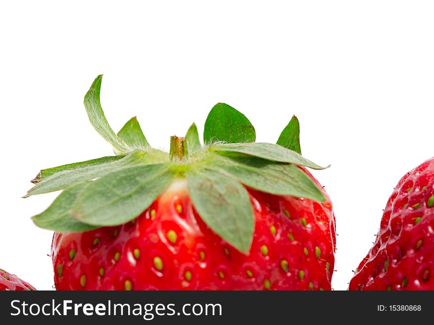 The strawberry on a white background close up.