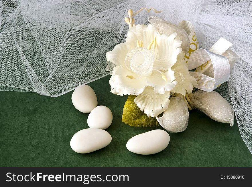 Candy wedding favors and packaging materials on a green background. Candy wedding favors and packaging materials on a green background