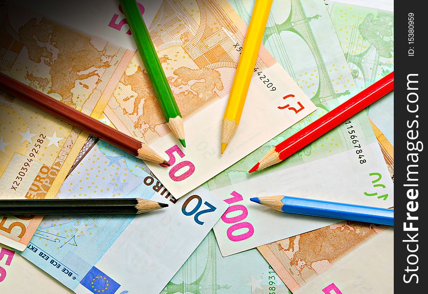 Colored pencils on a euro. Colored pencils on a euro.