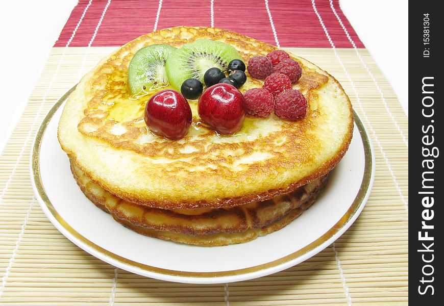 Sweet pancakes with raspberry kiwi honey and cherry fruits. Sweet pancakes with raspberry kiwi honey and cherry fruits