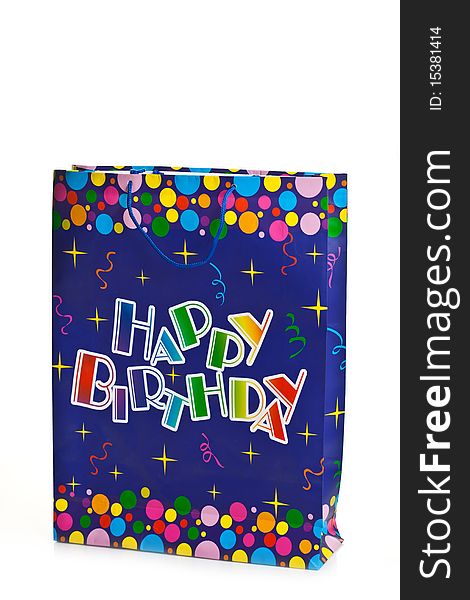Gift bag with an happy birthday illustration on it isolated on white