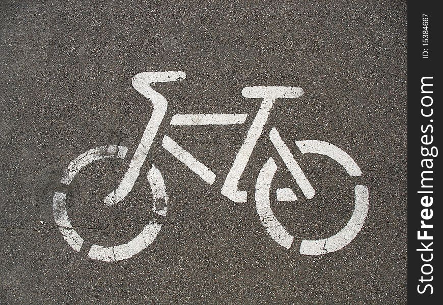 Urban bicycle symbols on the asphalt track. Urban bicycle symbols on the asphalt track