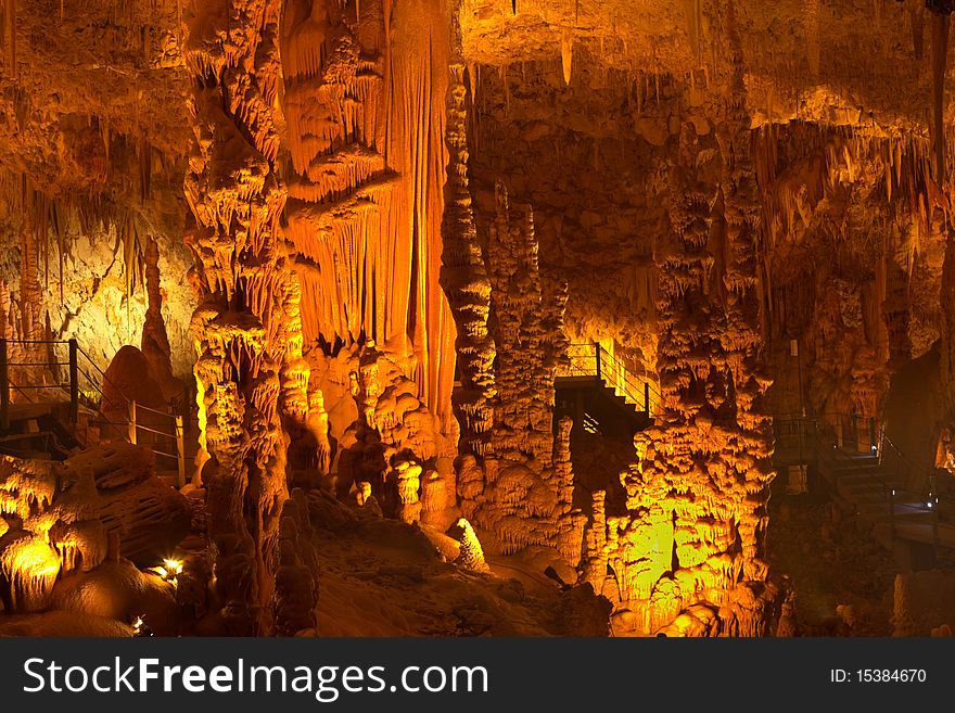 Stalactite and stalagmite cave with lights