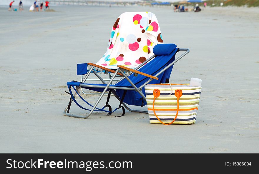 Two folding chairs at the beach; in horizontal orientation. Two folding chairs at the beach; in horizontal orientation