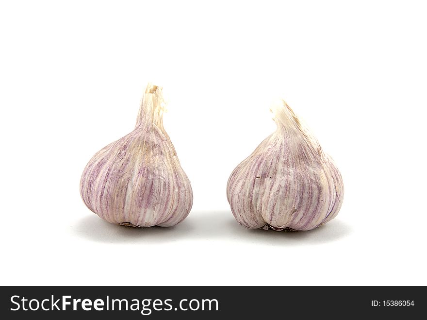 Studio shot of the two garlics over a white background. Studio shot of the two garlics over a white background