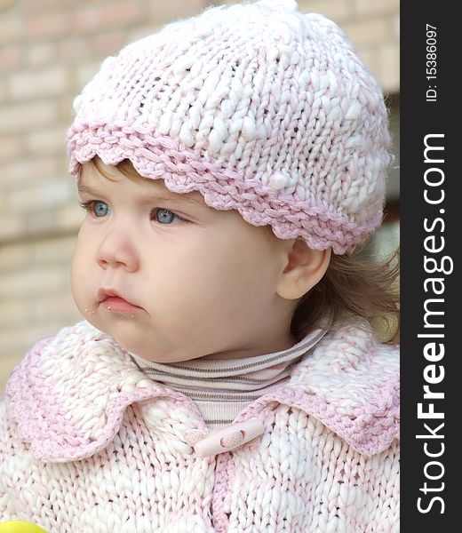 The serious baby in pink hat