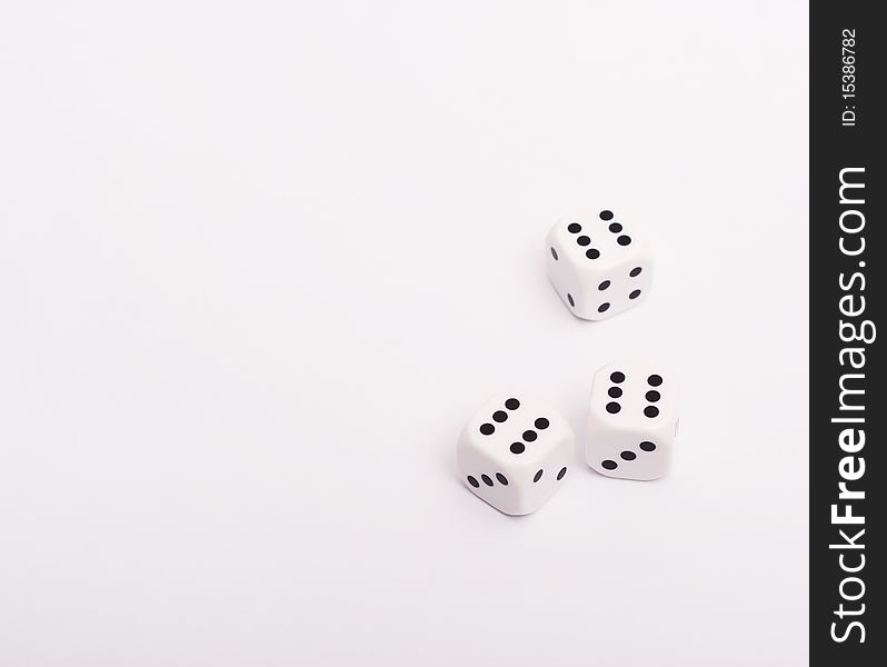 White dice on a white background.