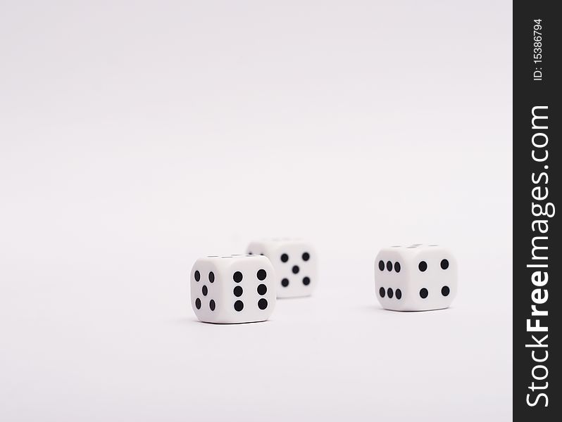 White dice on a white background.