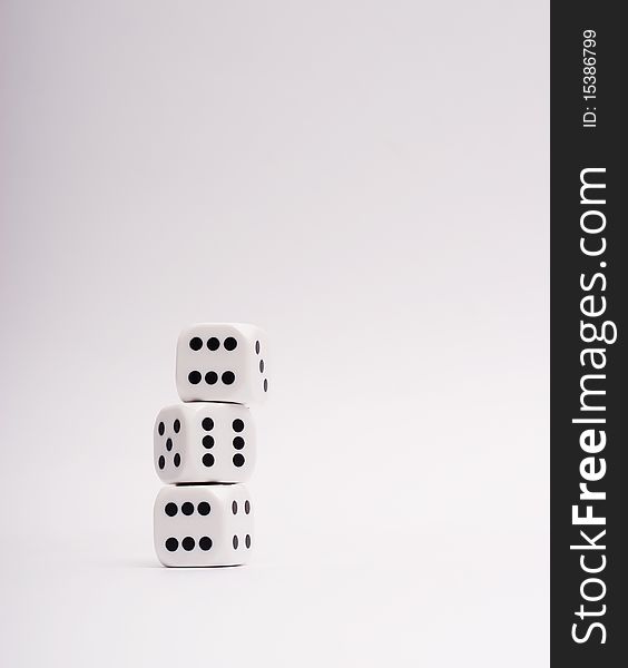 White dice on a white background.