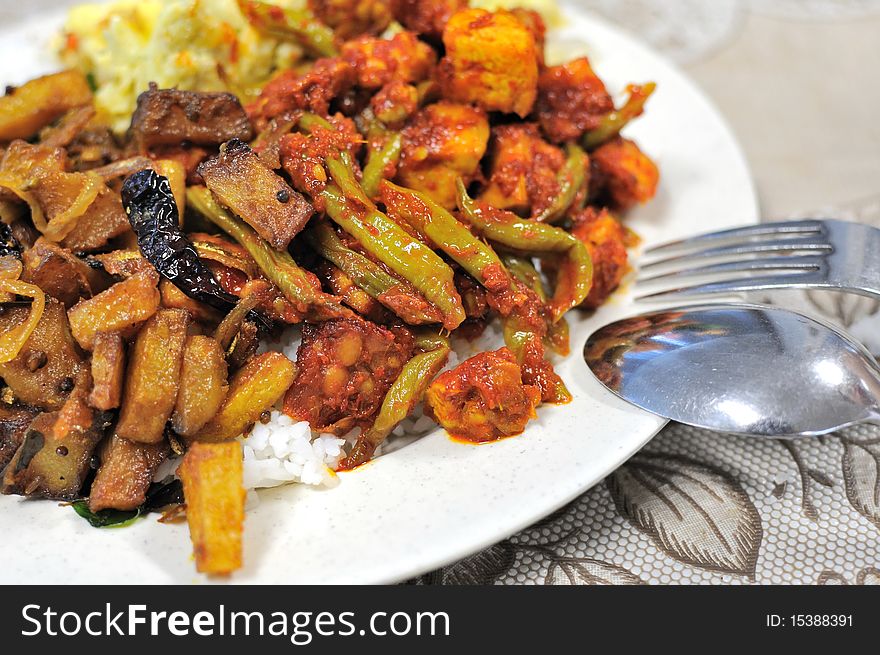 Spicy Malay set meal with variety of vegetables. For concepts such as food and beverage, healthy eating, and diet and nutrition.