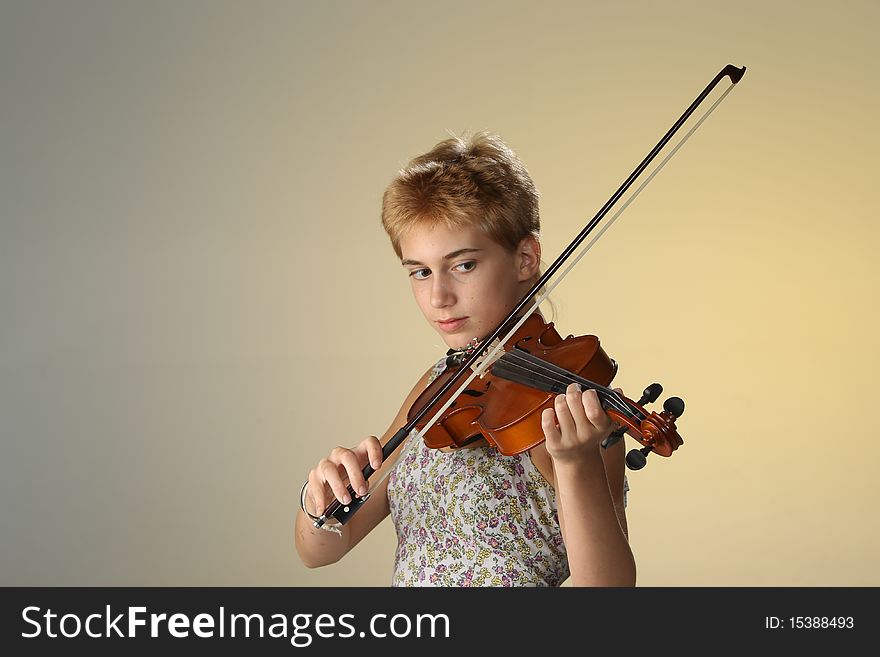 Girl in a tank topped dress with a violin. Girl in a tank topped dress with a violin.