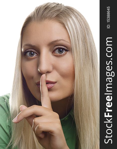 Shh. secret - Young girl with her finger over her mouth