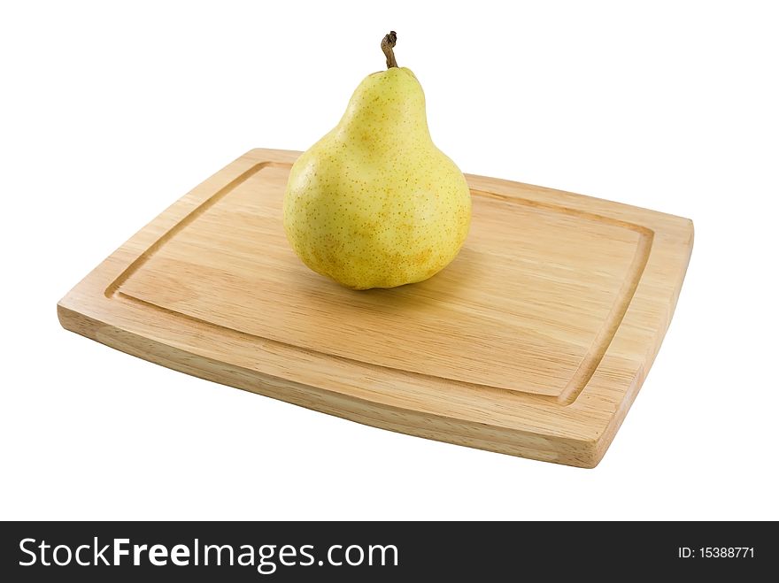 Pear on a chopping board. It is isolated on a white background