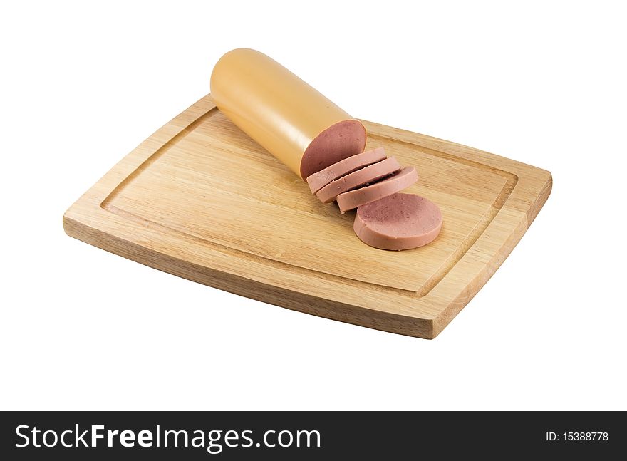 The sausage cut with slices on a chopping board. The sausage cut with slices on a chopping board.